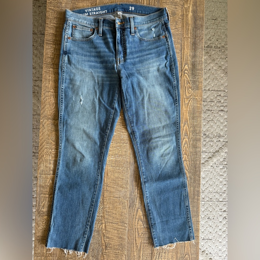 J.Crew Vintage Slim Straight blue denim jeans, slightly distressd. Raw hem.